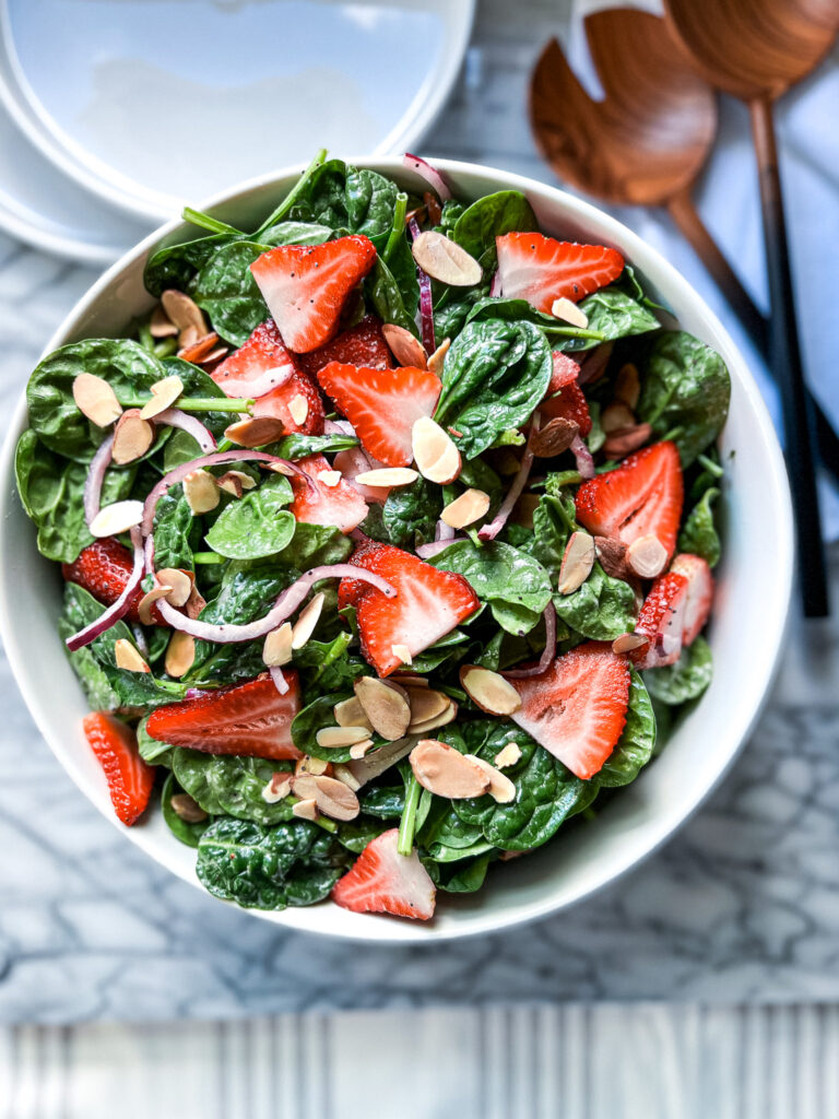 Strawberry Spinach Salad with Poppyseed Dressing on Marble board